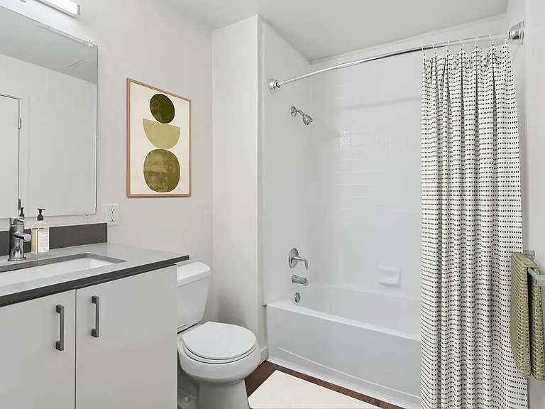 Classic Package II bath with white cabinetry, grey quartz countertops, and hard surface flooring