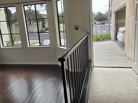 View of front door and garage from dining area.