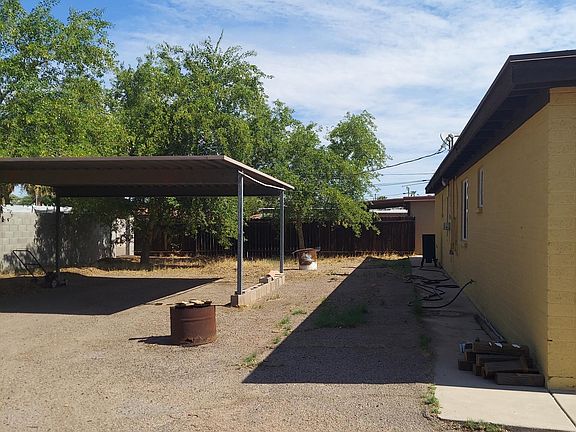 Backyard with assigned covered parking spots.