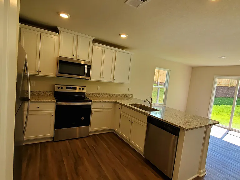 Kitchen with large countertop space and a big sink.