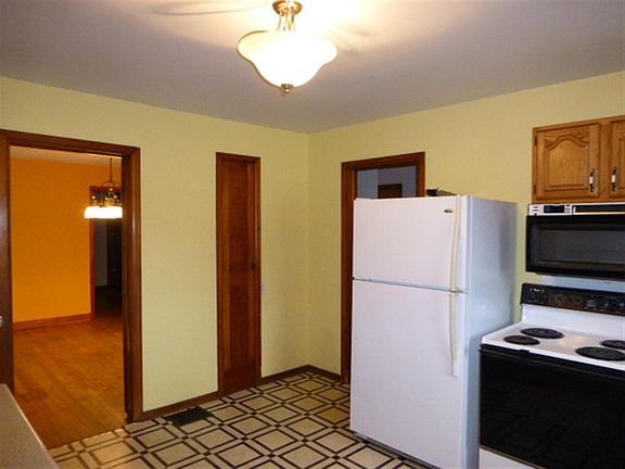 Kitchen leads into Dining 