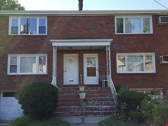 Front w/ Driveway/Garage
