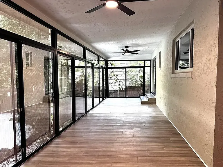 Florida room with new fans, new paint, and new porecelain tile