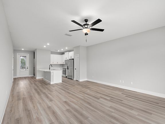 The kitchen opens up into the dining space