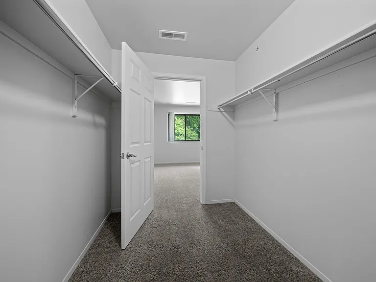 Spacious bedroom closet for ample storage at Woodland Villa Apartments in Westland, MI.