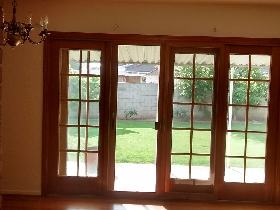 View of large backyard through French doors