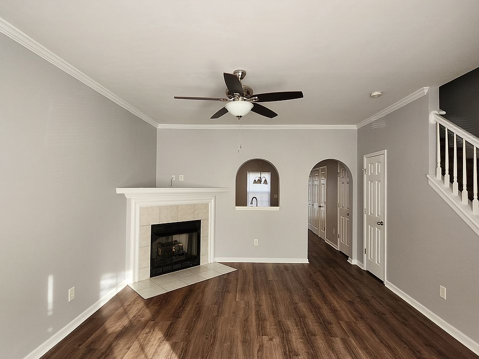Living room with view into kitchen