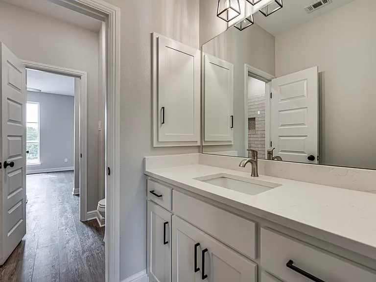 Another view of the Jack and Jill bath vanity for the second bedroom. All bathrooms come with Medicine Cabinet and white cabinets with handles