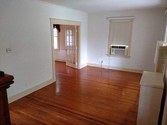 French doors connect living room and full sized dining room