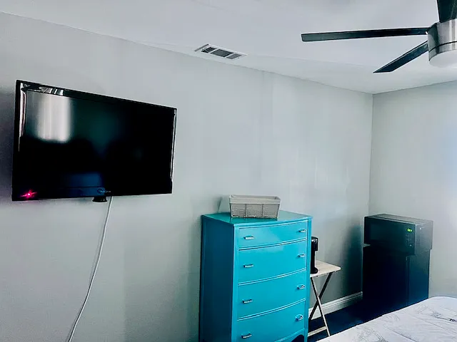 Bedroom #3: King-size Bed w/ memory foam mattress, Flat screen TV w/ Fire-stick, Ceiling fan, Dresser, Nite stands, Mini Fridge/Microwave, Spacious closet, Coffee maker