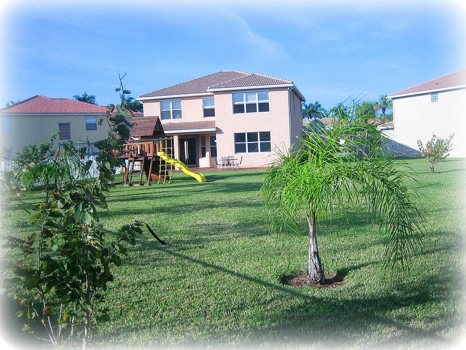 Huge .39 ac fenced backyard with fruit trees