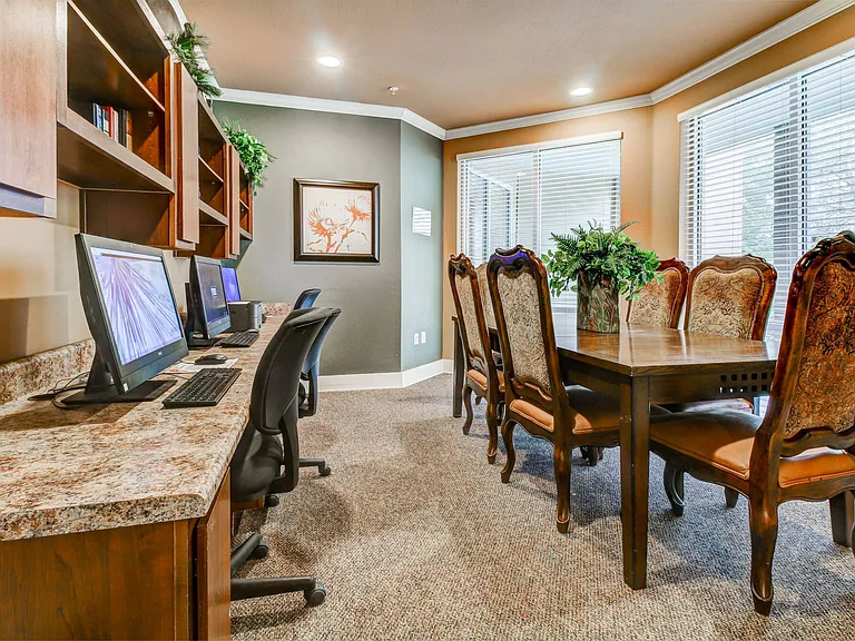 Business Center with conference table and computers