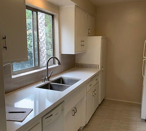 New sunny kitchen. Stainless and quartz.
