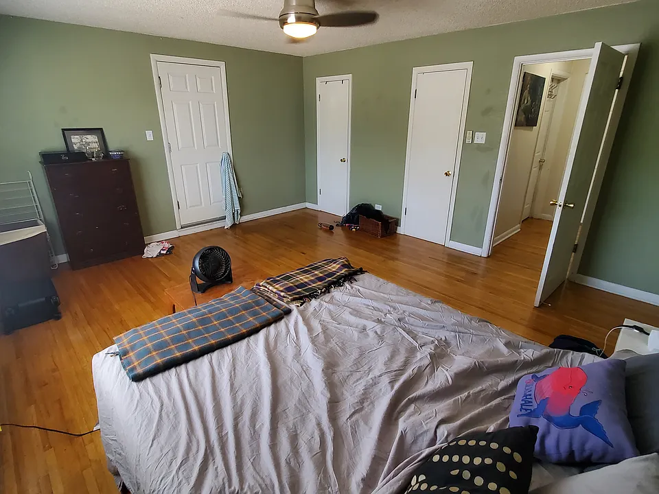 Master bedroom. Two doors on right access large interconnected closet. Door on left to rooftop deck.