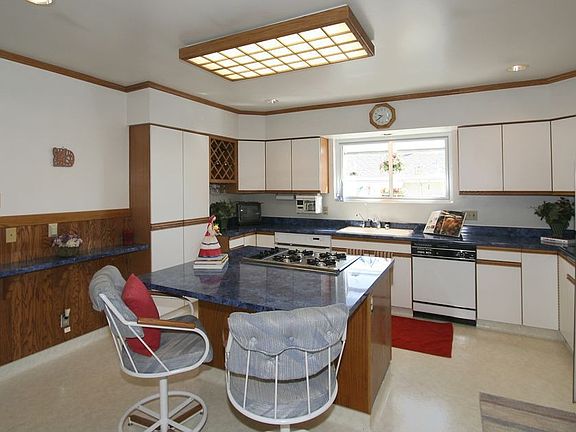 Spacious Kitchen with Wilsonart Counters and Gas Stove