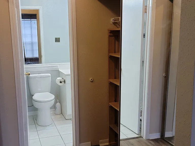 Full length mirror sliding doors for the closet.