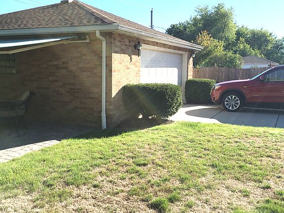 Garage with side patio