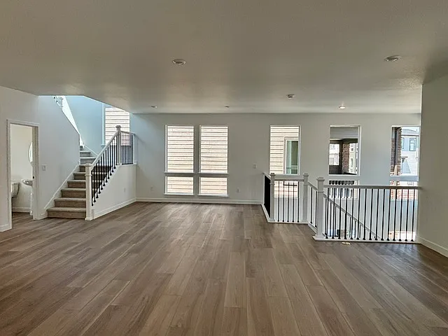 can lighting, metal spindles on all stair cases lots of windows for natural light