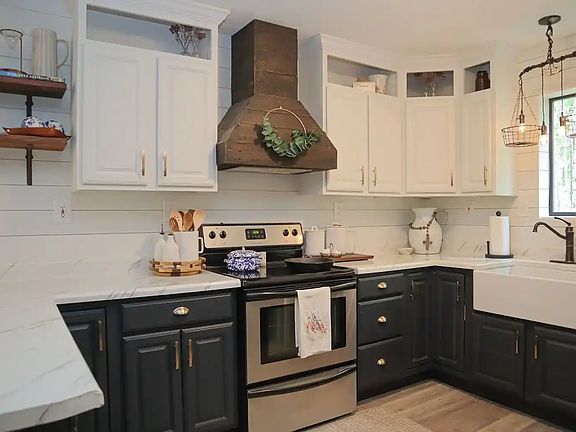 Kitchen with shiplap walls and farm sink