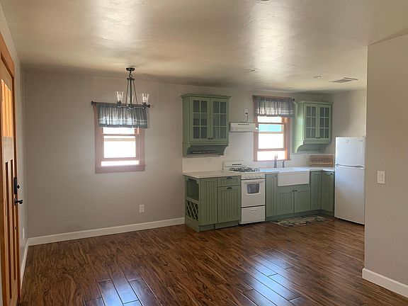 Facing dining area and kitchen from living room