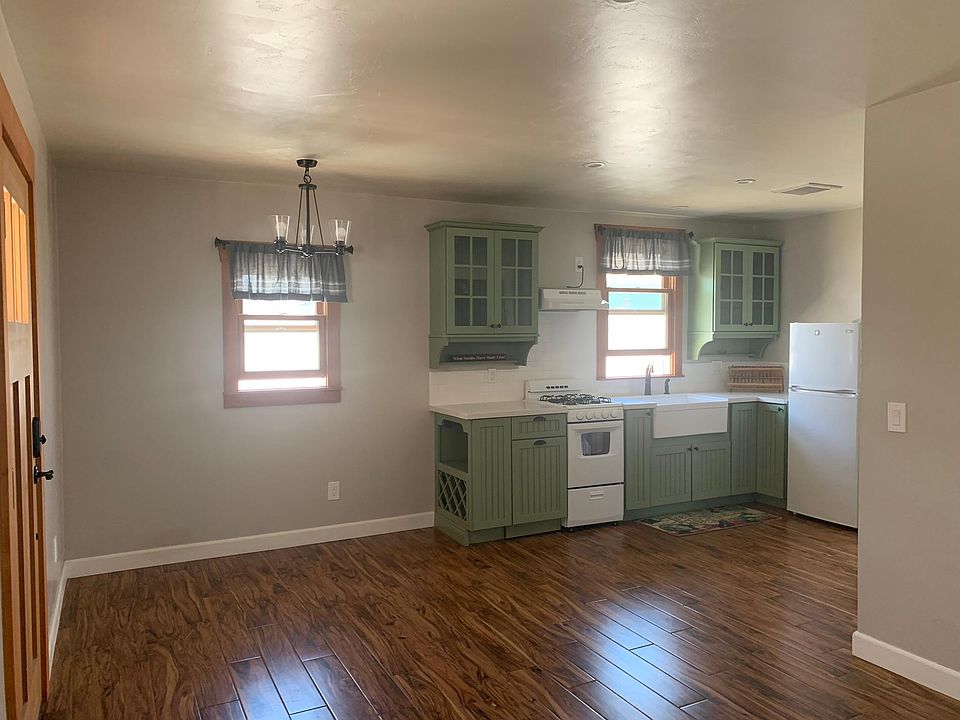Facing dining area and kitchen from living room
