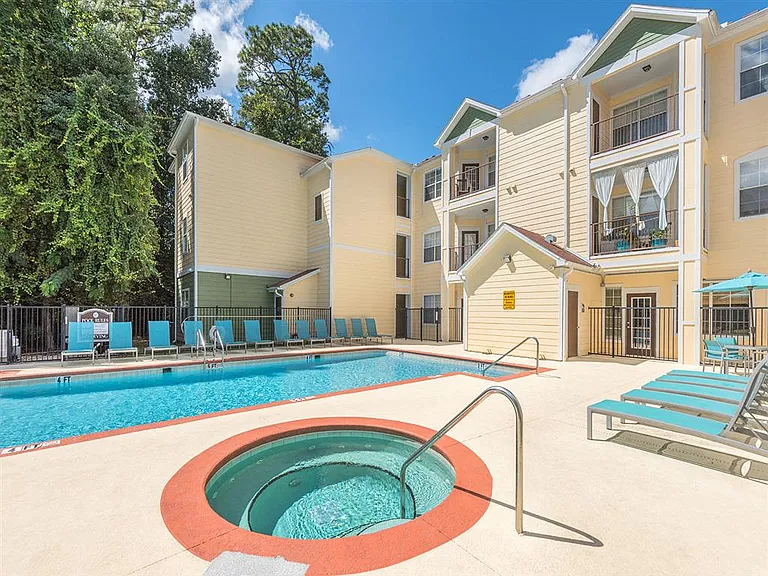 Hot tub spa next to the swimming pool