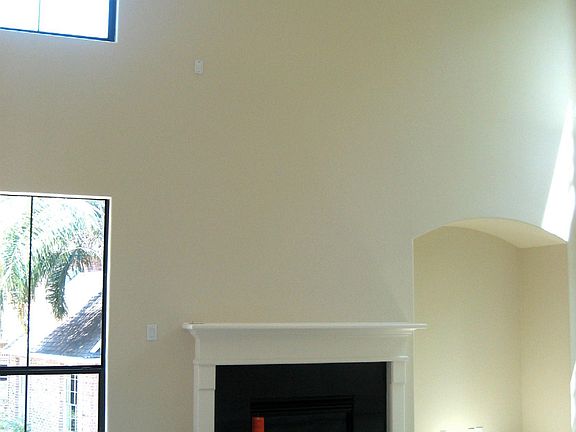 Den with Gas fireplace and two story ceilings