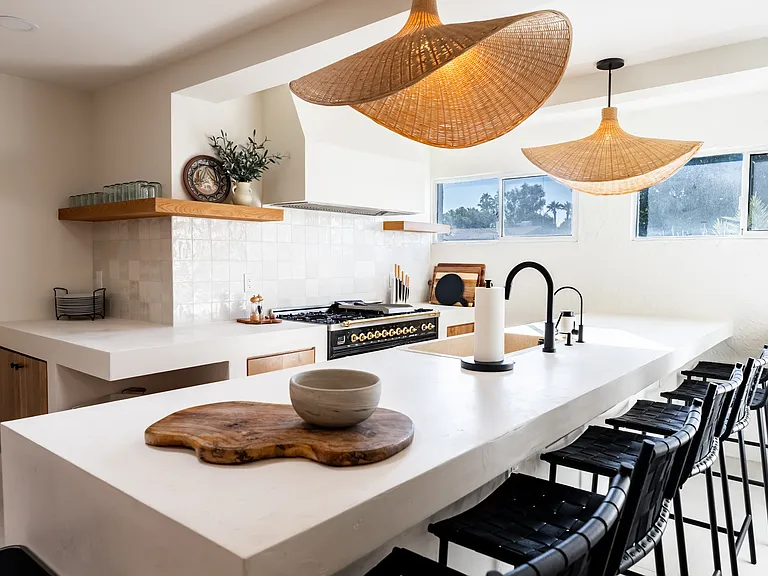 Kitchen (gas stove, stucco countertops, bar seating)