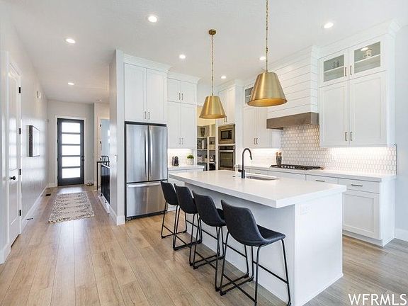 Kitchen. 2 microwaves and 2 built-in ovens. Gas stove top. Big pantry.