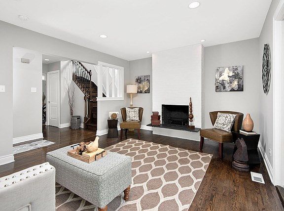 Large living room with wood burning fireplace