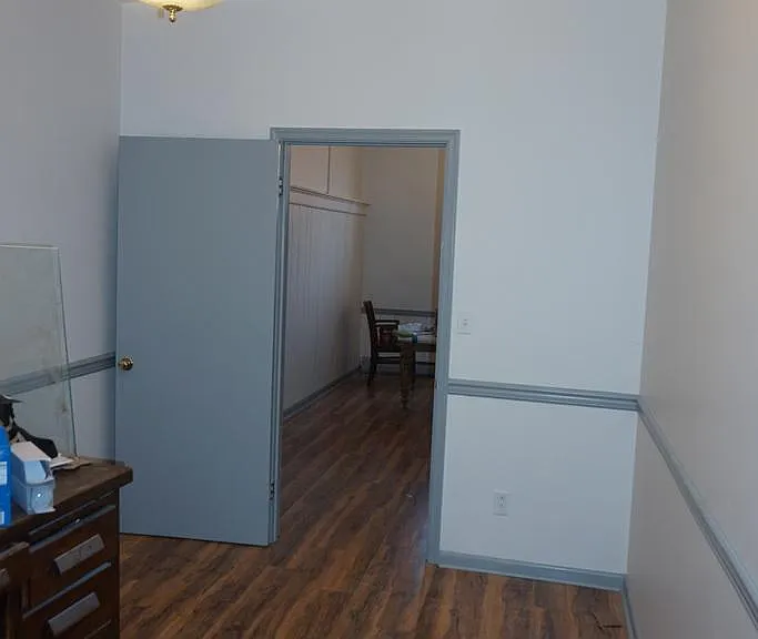 Bedroom, looking into the great room (living room/ kitchen combo).