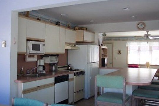 Kitchen Area with Large Counterbar for Extra Seating and Dining on the Go.