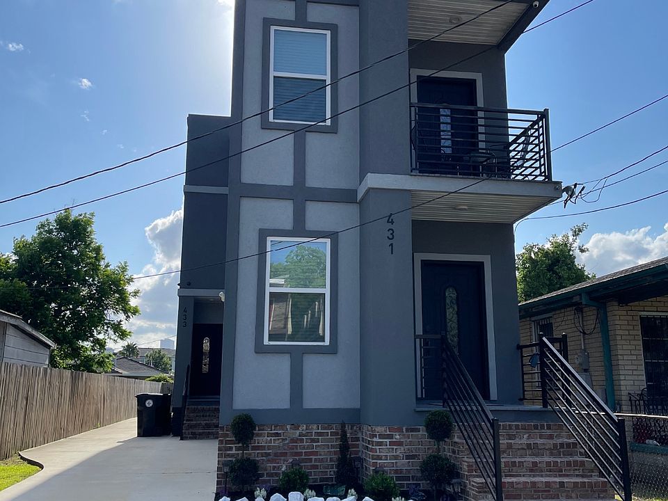 The front door is on the side up the driveway.