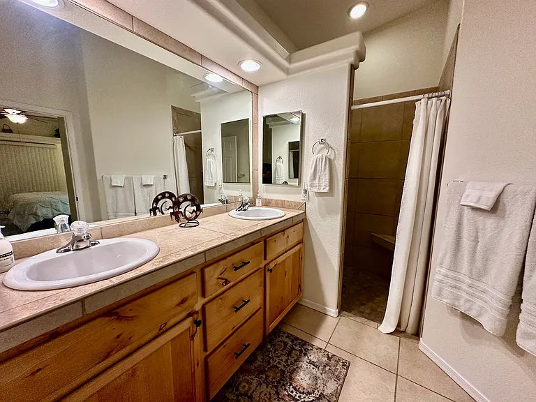 Master Bathroom with Double Sinks and Showerheads