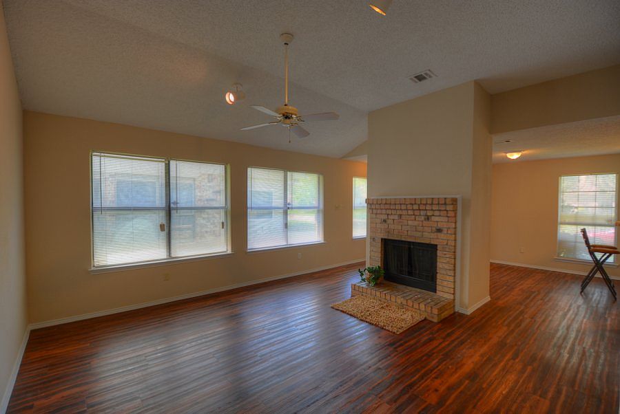 High Ceilings & Fireplace with Mantle & Brick Hearth