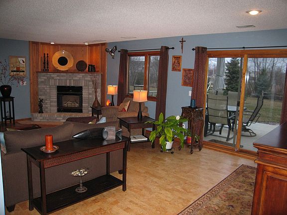Family room with fireplace, cork floor and walkout to deck