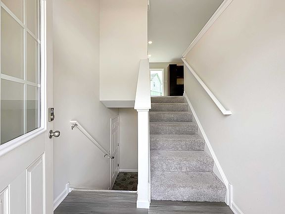 Split foyer entry - stairs up to main level and down to basement