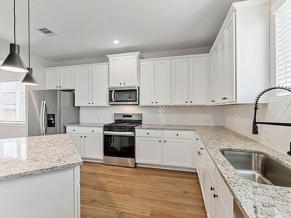 Stainless steel appliances are included