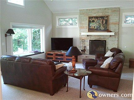 20 x 20 family room, vaulted ceiling, stone woodburning fireplac