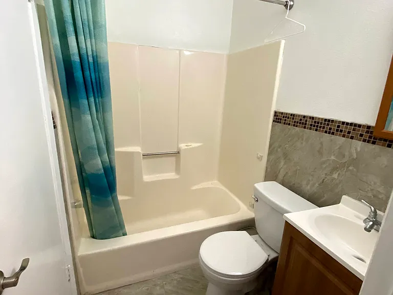 Second bedroom's bathroom with additional access to hallway