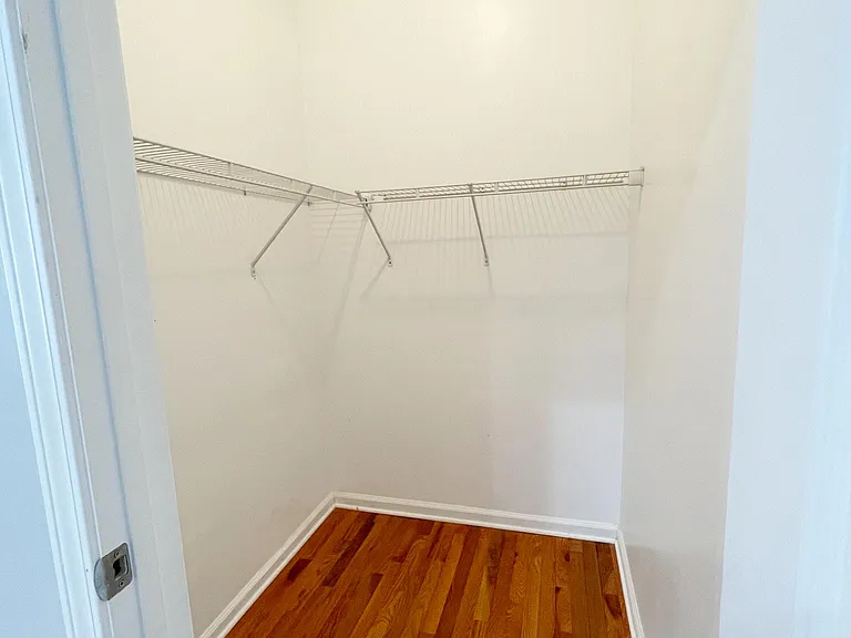 Master bedroom with en suite bathroom and walk-in closet