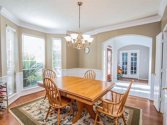 Looking across the dining area you can see the foyer and private study.