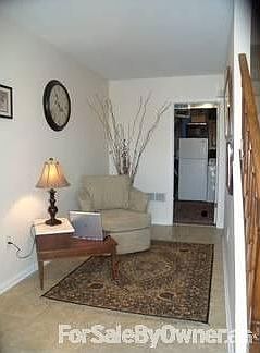 Foyer : New tile floor! Laundry and storage in the rear, with adjacent garage with shop.
