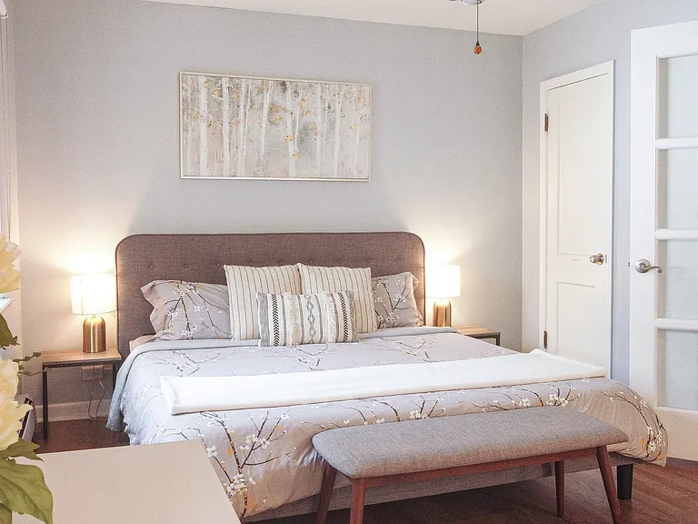 1st Bedroom: French Doors with Room-darkening Blinds for a Peaceful Sleep