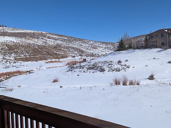 Winter view of open space (Swaner) from deck off living room. Spring Creek trail system on hill - just out the gate