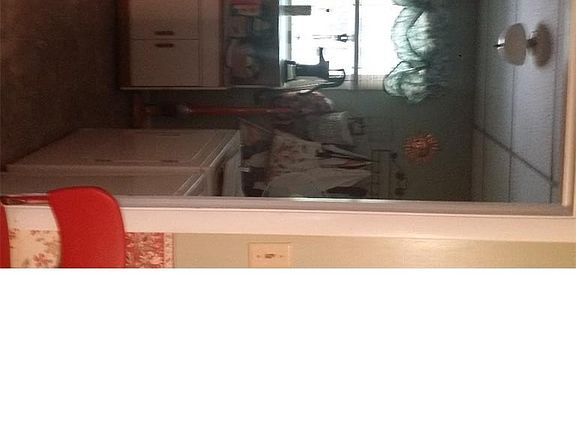 View into the laundry off the kitchen to garage