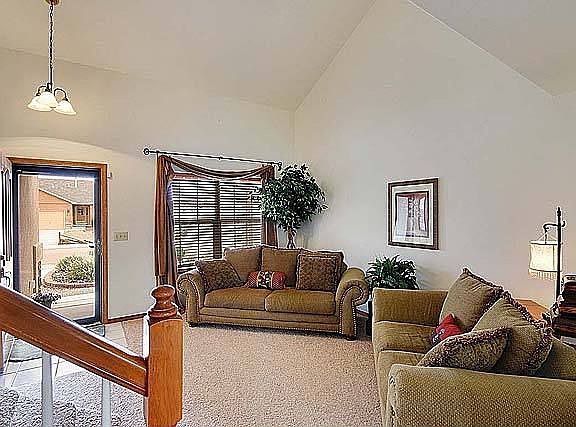 Formal living room with high vaulted ceilings.