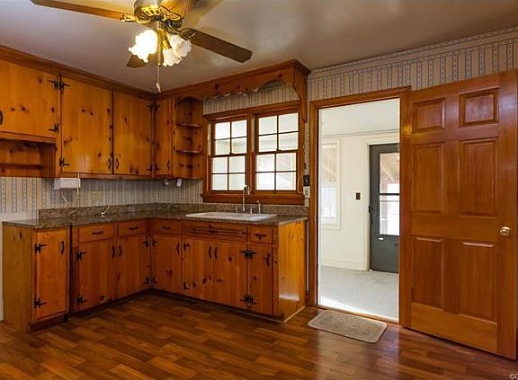 Kitchen with door to back porch/laundry room and exit to deck