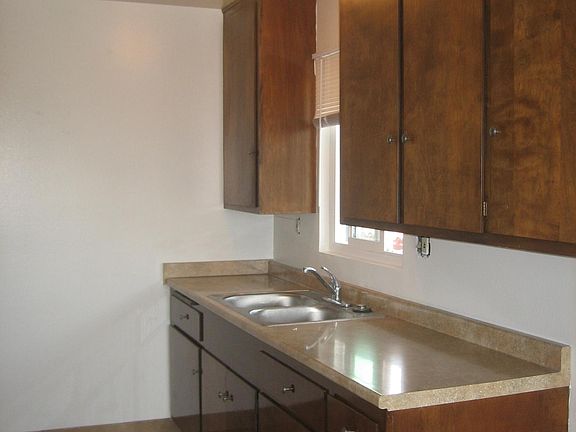 Large, clean kitchen with dishwasher