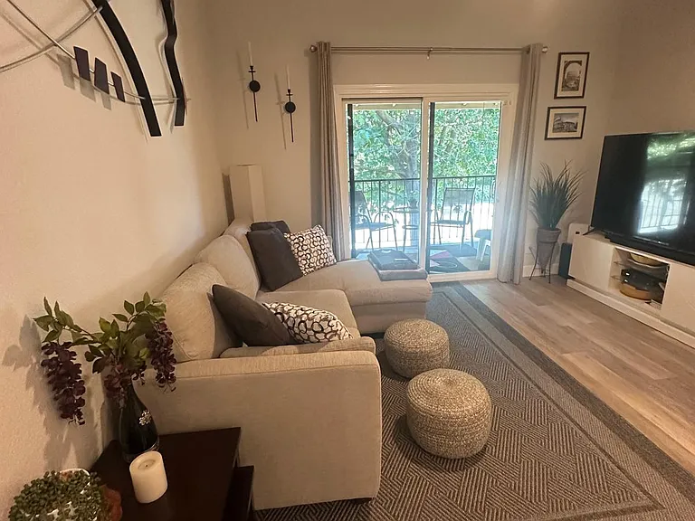 living area looking to sliding glass door to private patio